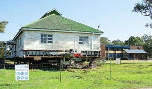 A picture of Edgar Harley Building being moved
